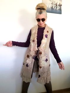 I designed and constructed this M size beige sleeveless cardigan.This boho chic vest can be worn every day or when you want to feel good and one of a kind.Length - 89 cm/ 35 inches Bust - 102 cm/ 40 inchesHips - 107 cm/ 42 inchesI used beige knit cotton blend sleeveless cardigan, laces,velvet,tulle,Preciosa glass beads, sequins..This embroidered fleece jacket is NOT STRETCHY !!!! Floral Spring Cardigan M Embroidered Knit Vest Machine wash on a gentle or wool program!!!!All my items are ready to ship within 1-3 working days. You will receive them in a special box or an envelope/protected with bubble wrap material inside/ of the Bulgarian National Post.I also add a special gift bag, handmade by me.This knit casual cardigan jacket is exclusive, one of a kind, because I don`t make more than on Bohemian Spring Vest For Layering, Bohemian Vest For Spring Layering, Sleeveless Beige Cardigan For Fall, Bohemian Sleeveless Summer Cardigan, Beige Sleeveless Cardigan For Fall, Sleeveless Bohemian Summer Cardigan, Bohemian Beige Cardigan For Layering, Fitted Bohemian Sweater Vest For Spring, Bohemian Sleeveless Embroidered Outerwear