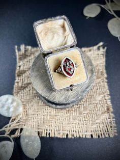 Antique Marquise Ring  15ct Gold Tested  Circa 1850 Fabulous, early Victorian ring. Beautiful marquise/navette shaped, decorated with gorgeous red & white enamel which is in perfect condition. The centre of the ring features a beautiful, natural diamond, crowned heart.  Set in lovely, yellow gold with fancy, diamond set shoulders. Such a beautiful piece!  Face of the ring measures approx height 20mm & width 12.6mm UK Size R US Size 8 1/2  Can be resized using our resizing service, please contact Antique Enamel Wedding Ring, Victorian Hallmarked Oval Enamel Ring, Victorian Oval Hallmarked Enamel Ring, Antique Enamel Ring With Rose Cut Diamonds, Victorian Hallmarked Enamel Ring For Wedding, Victorian Style Hallmarked Enamel Ring For Wedding, Antique Red Diamond Ring With Rose Cut Diamonds, Red Victorian Diamond Ring, Antique Hallmarked Enamel Wedding Ring