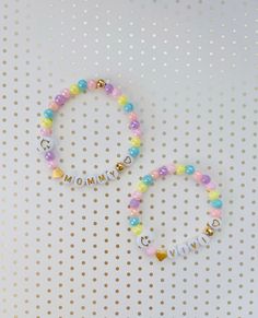 "This dainty MOMMY & DAUGHTER matching bracelet set is the cutest accessory ever! It is the best way to show off the ❤️love between you and your little girl! Each bracelet comes with a 24K heart bead and 24k gold beads AND a happy 😄 face bead to tell everyone how lucky you are to be a mom! Of course, you can have any names/words on the bracelets! 💝Add an extra charm or 2 for a low price of $1 each - https://etsy.me/36LE9om 💗We offer gift wrapping option with a nice jewelry box and make th First Day Of School Bracelet, Mini Bracelet, Daughters Day, Mommy And Baby, Nice Jewelry, Daughter Jewelry, Moms Bracelet, Baby Bracelet, Mom And Daughter