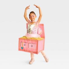 Help your kid take their performance to the next Halloween party with the Kids' Music Box Ballerina with Sound Halloween Costume Dress from Hyde & EEK! Boutique™. Made from lightweight material, this ballet costume dress includes a rose-embellished choker and a pink dress designed like a music box. Plus, this costume produces sound for extra fun and comes with the three required AAA batteries. Hyde & EEK! Boutique™: Thrilling delights. Curious oddities. Creative Family Of 4 Halloween Costumes, Diy Ballerina Costume Kids, Rockette Costume Halloween, Inanimate Object Costume, Creative Kids Costumes, Kid Costumes For Halloween, Dance Halloween Costumes, Unique Halloween Costumes For Kids, Girls Costume Ideas