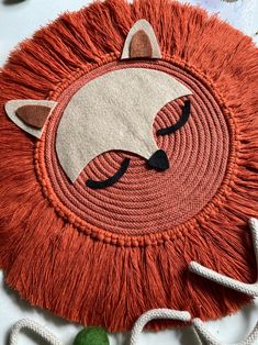 a close up of a rug with a cat face on the front and back of it