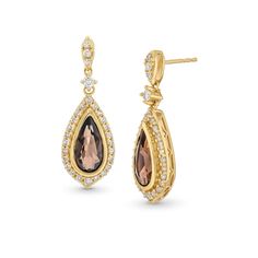 Go all in for drama with these gorgeous gemstone and diamond drop earrings. 10K gold Each earring showcases a 10.0 x 5.0mm pear-shaped smoky quartz bezel-set in a polished frame A sparkling halo of round diamonds frames the center stone More diamonds decorate the bridge and post 1/2 ct. t.w. of diamonds Friction backs Pear-shaped Diamond Earrings For Evening, Formal Diamond Earrings With Gemstone Accents, Evening Fine Jewelry Pear-shaped Diamond Earrings, Pear-shaped Diamond Earrings With Accents For Evening, Elegant Teardrop Diamond Earrings Fine Jewelry, Teardrop Diamond Earrings With Elegant Design, Formal Briolette Diamond Accented Earrings, Formal Briolette Earrings With Diamond Accents, Elegant Formal Diamond Earrings With Gemstone Accents