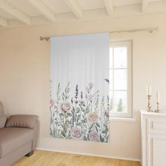 a living room with a couch and window covered in floral curtain valance, next to a chair