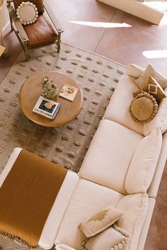 a living room filled with furniture and pillows