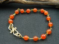 "You will receive 1 Natural carnelian bracelet, Carnelian beaded bracelet, Smooth bead, Gemstone Bracelet, Handmade, Charm Bracelet, Beautiful Gift, Gift For her Stone : carnelian Bracelet Size: 7\" long Many thanks for you visit my store ♥ if you have any question please contact us. For wholesale Price Please Convo me. You can order different items as many you like ." Bohemian Carnelian Bracelets With Round Beads, Amber Carnelian Round Beaded Bracelets, Amber Carnelian Bracelets With Round Beads, Healing Carnelian Beaded Bracelets, Amber Carnelian Beaded Bracelets - Gift, Amber Carnelian Beaded Bracelet Gift, Orange Hand Wrapped Bracelet Jewelry, Beaded Round Carnelian Bracelets, Gold Carnelian Beaded Bracelets For Spiritual Wear