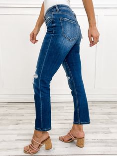 Be the cool kid on the block with MICA Denim Mid-Rise Straight Leg Denim Jeans. These stylish jeans feature a mid-rise waist and straight-leg fit for all-day comfort. The perfect addition to any wardrobe, these jeans will have you looking and feeling your best. (No boring mom jeans here!) Fabric content: 93.5% Cotton, 5% Polyester, 1.5% Spandex Front Rise: 9.25", Inseam: 29", Leg Opening 14.25" Dark Wash Straight Leg Jeans With Frayed Hem, Everyday Distressed Dark Wash Flare Jeans, Distressed Mid-rise Cropped Jeans For Everyday, Everyday Dark Wash Distressed Flare Jeans, Dark Wash Ripped Jeans For Everyday, Everyday Dark Wash Mid-rise Cropped Jeans, Everyday Mid-rise Dark Wash Cropped Jeans, Stretch Straight Leg Cropped Jeans For Everyday, Medium Wash Distressed Straight Leg Jeans