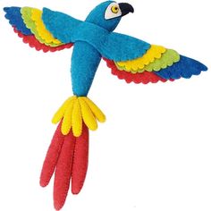 a colorful parrot flying through the air with its wings spread out to catch food in it's mouth