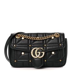 This is an authentic GUCCI Calfskin Matelasse Studded Small Pearly GG Marmont Shoulder Bag in Black. This handbag is crafted of soft, quilted calfskin leather in black with pearls and aged gold stud detailing throughout. The bag features a gold chain strap with black shoulder pad and a pearl lined GG logo on the front flap. This opens the bag to a beige microfiber interior with a zipper pocket. Gucci Soft Leather Shoulder Bag, Gucci Soft Leather Rectangular Shoulder Bag, Gucci Soft Leather Crossbody Bag, Elegant Gucci Soft Leather Bags, Gucci Luxury Soft Leather Shoulder Bag, Luxury Gucci Shoulder Bag In Soft Leather, Luxury Gucci Soft Leather Shoulder Bag, Gucci Soft Leather Crossbody Shoulder Bag, Designer Gucci Shoulder Bag In Soft Leather