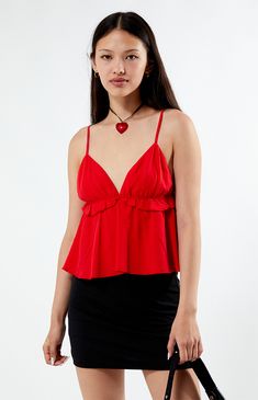 The Ruffle V-Neck Babydoll Top from LA Hearts features a chic V-neckline and adjustable straps for a perfect fit, with a flattering babydoll silhouette and playful ruffle details. Its cropped length adds a trendy touch, making it an ideal piece for any casual ensemble.


	Woven fabric
	Unlined
	V-neckline
	Adjustable straps
	Ruffle details
	Cropped length
	Relaxed fit
	Model is wearing a size small Party Top With Delicate Straps And V-neck, Flirty Red Tank Top For Spring, Party Tops With Delicate Straps And V-neck, Party V-neck Top With Delicate Straps, Red V-neck Camisole For Party, Flirty V-neck Top With Built-in Bra, Flirty V-neck Camisole For Date Night, Fitted Red V-neck Camisole, Red V-neck Camisole For Summer