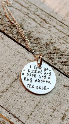 "Please leave a phone number in the checkout notes in case I need to call or text to get more information. Thanks. PLEASE READ SHOP ANNOUNCEMENT AND POLICIES. Hand stamped on sterling silver with a sterling silver chain. \"I love you a bushel and a peck and a hug around the neck.\" All of our items are hand stamped by me and not a machine, so spacing and alignment may be imperfect, which can add to the charm and character of hand stamped jewelry. Because of the uniqueness of the craft, the lette Meaningful Hand Stamped Charm Necklace Gift, Meaningful Hand Stamped Jewelry For Birthday Gift, Personalized Hand Stamped Charm Necklaces, Meaningful Hand Stamped Charm Necklace For Mother's Day, Meaningful Hand Stamped Charm Necklaces For Mother's Day, Meaningful Stamped Charm Necklaces For Mother's Day, Hand Stamped Meaningful Necklaces For Valentine's Day, Meaningful Hand Stamped Necklaces For Valentine's Day, Hug Around The Neck