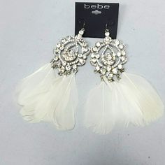 Silver Rhinestone White Feathers Dangle Earrings By Bebe White Rhinestone Teardrop Crystal Earrings, White Crystal Rhinestone Teardrop Earrings, White Teardrop Crystal Earrings For Party, White Teardrop Crystal Earrings With Rhinestones, White Rhinestone Chandelier Drop Earrings, White Rhinestone Chandelier Earrings, White Rhinestone Chandelier Earrings For Party, White Rhinestone Dangle Crystal Earrings, White Dangle Crystal Earrings With Rhinestones