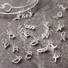 Purchase the Mini Rhodium-Colored Alphabet Capitals Charm Set by Bead Landing™ at Michaels. Create a personalized bracelet or a key chain for your friends and siblings using this mini alphabet capitals charm set by Bead Landing. Create a personalized bracelet or a key chain for your friends and siblings using this mini alphabet capitals charm set by Bead Landing. These tiny letters add cuteness to your DIY art projects. Details: Rhodium-colored 26 pieces Attached jump rings Nickel free Zinc allo Alphabet Charms, Bead Landing, Diy Art Projects, Personalized Bracelet, Charm Set, Jump Rings, Charm Jewelry, Diy Art, Key Chain