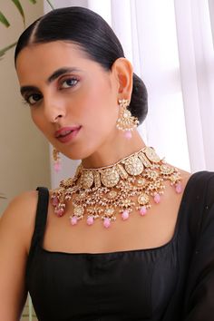 Gold toned choker with kundan embellishment and pearl drops. Comes with earrings.
Components: 1 Necklace, Pair of Earrings
Type: Kundan, pearl
Composition: Brass
Color: Pink
Handmade
Dimensions (inches)L x W: 14 x 15
Weight (gms): 490 - Aza Fashions Jewellery Kundan, Pink Jewelry Set, Choker Jewellery, Choker Set, Flesh And Blood, Jewelry Choker, Jewellery Set, Fashion App, Yu Gi Oh