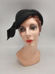 1930s Black Wool Felt Sculptural Style Cloche Brand: Veeda Louisa Measurements: Interior Band Circumference: 20" Height: 2 ~ 3" Condition: Hat is in great vintage condition. Wool felt is in great shape. Some small discoloration around interior hat band and label. See photos for reference. Retro Fitted Formal Hat, Fitted Vintage Hats For Vintage Fashion, Fitted Retro Hats For Vintage Events, Retro Fitted Hats For Vintage Events, Fitted Vintage Hats, Mini Hats, Hat Band, Black Wool, Fascinator