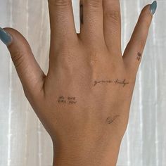 a woman's hand with writing on it