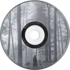 a man standing in the middle of a forest surrounded by tall trees on a cd cover