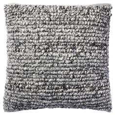 a gray and white pillow on a white background