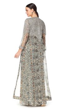 Grey gown with floral printed motifs. Comes with organza Swarovski jacket.
Components: 2
Fabric: Georgette, Organza
Neckline: V neck
Sleeve Length: Three quarter
Color: Grey
Embroidered
Swarovski embroidered gown
Organza jacket
Floral printed motifs
Sheer sleeves - Aza Fashions Elegant Dress With Resham Embroidery And Front Open, Elegant Front Open Party Dress, Elegant Georgette Sets With Floral Print, Silk Dresses With Sheer Dupatta For Transitional Season, Front Open Georgette Dresses, Elegant Floor-length Kurta For Spring, Elegant Maxi Kurta With Floral Embroidery, Elegant Floral Embroidered Maxi Kurta, Elegant Organza Maxi Sets