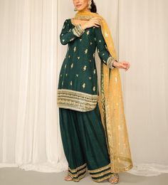 Green raw silk knee length kurti has beautiful lace borders embroidery on top and bottom paired with contrast yellow organza dupatta with lace detailing. This beautiful dress is per for wedding function and mehendi ceremony  ✨If you want any changes in the outfit please contact us. This dress can be customise in any other colour and in all size.We will make this dress as per your choice ✨There may be slight colour difference due to high quality camera resolution and other filters.  🌸Care Instruction Dry clean only Semi-stitched Green Chinon Unstitched Suit, Green Anarkali Unstitched Suit In Georgette, Festive Green Georgette Unstitched Suit, Green Chinon Kurta With Dabka Work, Green Chinon Lawn Suit With Dupatta, Green Resham Embroidered Salwar Kameez In Chinon, Green Kurta With Dabka Work In Chinon, Designer Green Lawn Suit With Zari Work, Green Chinon Unstitched Suit With Resham Embroidery