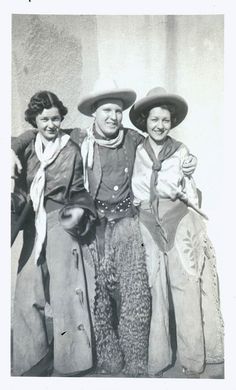 an old photo of three women in cowboy hats