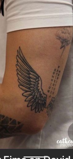 a woman with a tattoo on her arm and the words time to fly above it