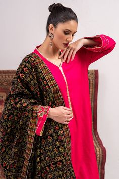 A shocking pink raw silk suit highlighted with embroidered motifs on the sleeves and with matching Kashmiri machine embroidery on the black velvet shawl.3-piece suitReady-to-wear Pink Raw Silk Dupatta For Formal Occasions, Pink Silk Traditional Wear For Formal Occasions, Formal Pink Raw Silk Dupatta, Formal Pink Silk Traditional Wear, Formal Pink Silk Dupatta, Pink Silk Unstitched Suit For Formal Occasions, Pink Formal Salwar Kameez With Dabka, Traditional Pink Lawn Suit For Formal Occasions, Formal Pink Silk Unstitched Suit