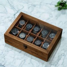 Elevate the presentation of your prized watch collection with our exquisite Wooden Watch Box, showcasing a rustic solid wood exterior accentuated by rich grains and a sizable clear glass element. This opulent piece not only fulfills your storage requisites but also serves as a captivating adornment, enhancing the allure of your timepieces and embellishing your living space. Wood Organizer, Wooden Watch Box, Watch Display Case, Mens Watch Box, Wood Exterior, Jewelry Organizer Storage, Watch Boxes, Organization Gifts, Velvet Interiors