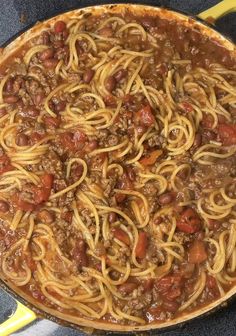 a large pot filled with spaghetti and meat