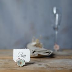 Handmade ceramics from our studio on Dartmoor, Devon. A place card holder and/or wedding favour in one. Style the easily malleable wire on our beautiful flowers to hold place names and be a part of the wedding table decorations simultaneously. There are lots of decorative possibilities. Get creative with a DIY centerpiece or wedding flower arrangement using the carefully designed ceramic wire flowers. Spiral the stems around champagne glasses or secure napkins, there is a variety of things you can do. We care about the environment and being as eco-friendly as possible, so when we designed these beautiful flowers we knew we were onto something! They're long lasting and reusable if handled with care, and can be used in a variety of DIY crafts or in decorative displays and arrangements. Pleas Flower Name Card, Flower Place Cards, Dartmoor Devon, Christmas Tea Light Holder, Card Holder Wedding, Whimsy Flowers, Mint Wedding Favors, Diy Centerpiece, Place Card Holders Wedding