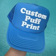 HOW TO ORDER Please check and review the product photos. Choose your hat color. Choose your puff color. Please add your personalization. Click "Add To Cart". You may go back to add as many variations as you would like, or you may simply checkout.  If you have any questions, we are always here to help.  PRODUCT DETAILS Our puff print hats are a perfect blend of style and comfort! Hand crafted with care, these hats have a 100% polyester front and mesh back, giving you that classic yet breathable f Customizable Bucket Hat One Size Fits Most, Customizable Bucket Hat, One Size Fits Most, Customizable Bucket Hat One Size, Customizable One Size Bucket Hat, Novelty Customizable Baseball Cap, Customizable Adjustable Blue Trucker Hat, Customizable Blue Snapback Baseball Cap, Customizable Bucket Hat, Fun Blue Customizable Hat