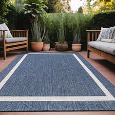 a blue and white rug sitting on top of a patio