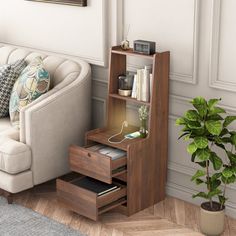 a living room with a couch, chair and bookcase on the floor next to a potted plant