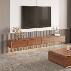 a large flat screen tv mounted to the side of a wall in a living room