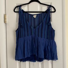 Fun, Cool Blue Top By Anthropologie Brand Akemi + Kin. Never Worn In Perfect Condition. Straps Are Adjustable With Ties. Blue V-neck Tank Top For Summer, Blue V-neck Summer Tank Top, Summer Blue V-neck Tank Top, Blue V-neck Tank Top For Vacation, Blue Summer Tank Top For Day Out, Indigo Sleeveless Top For Spring, Sleeveless Indigo Tops For Spring, Blue Bohemian Summer Top, Bohemian Blue Summer Top