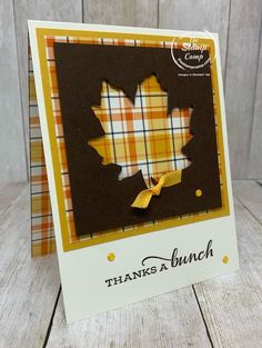 a handmade card with a plaid pattern and a yellow bow on the front that says thanks to bunch