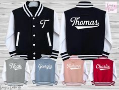 Looking for the perfect personalised custom kids varsity jacket? Our supersoft, college baseball children's varsity jacket is the ultimate blend of style and comfort. With its letterman style design, it's a must-have for kids, toddlers and babies alike.  Featuring a name on the back and initial on the front, our jacket allows you to add a personal touch that your child will love. It's the ideal birthday, new baby, or Christmas gift. Plus, with the option to match siblings, you can create adorabl Customizable Varsity Baseball Jersey, Customizable Varsity Baseball Jersey With Baseball Collar, Varsity Letter Print Baseball Jersey For College, Varsity Baseball Jersey With Letter Print For College, White Varsity Jacket For Game Day In Fall, School White Cotton Varsity Jacket, White Cotton Varsity Jacket For School, White Varsity Jacket With Ribbed Cuffs And Baseball Collar, White Cotton Varsity Jacket With Letter Print