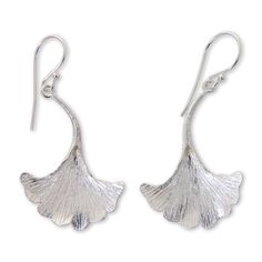 The unique shape of the oyster mushroom becomes a pair of sterling silver earrings with a textured finish. Desi Antari transforms nature's exotic beauty into earrings of exquisite artistry. Sterling silver Hook earrings Combination finish Handmade in & fairly traded from Indonesia Paw Print Jewelry, Oyster Mushroom, Mushroom Jewelry, Ribbon Jewelry, Printed Jewelry, Silver Dangle Earrings, Flip Flop Shoes, Sterling Silver Dangle Earrings, Women Artisans