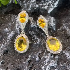 ✰ 2 shiny yellow cz gemstones makes the drop earring with halo more sparkly and graceful  ✰ This delicate lab-created handmade gemstone dangle earrings is perfect for people who want to achieve a brilliant and splendid look ✰ This yellow earrings dangle not only suitable for formal occasions such as banquets, weddings, theme parties, but also for everyday wear ✰ This dangle earrings wedding is a very special gift for birthday, Mother's Day, Valentine's Day and more  ✰ Comes with an exquisite gift box We also offer the ring and necklace from the same collection: https://www.etsy.com/listing/1236503255/yellow-zircon-ring-with-halo-yellow-oval https://www.etsy.com/listing/1220589212/oval-zirconia-necklace-perfect-birthday Materials: Environmentally-friendly copper Needle Materials: Silver Qua Elegant Yellow Earrings With Halo Design, Formal Yellow Earrings With Halo Setting, Yellow Oval Halo Jewelry, Yellow Gemstone Earrings For Wedding, Yellow Halo Jewelry For Gifts, Elegant Yellow Jewelry With Halo Design, Elegant Yellow Halo Design Jewelry, Yellow Round Cubic Zirconia Earrings, Yellow Halo Design Earrings For Gift