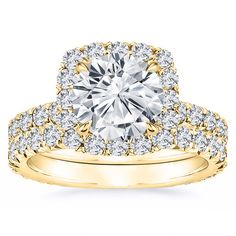 a yellow gold engagement ring with two rows of diamonds