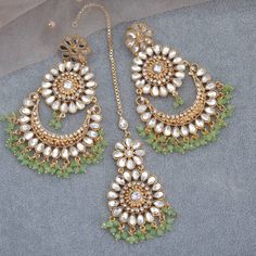 This 'URWA' Hight Quality Pakistani Kundan Earrings and Maang Tikka Set are the ultimate in versatile  Indian jewelry. Wear them together or Tikka and Earrings Their own. you can create three different looks with one set. Choose from two colors: Mint and Red Earrings drop Lenth: 10cm width: 5.5cm Tikka Drop 9cm approx This gorgeous pair is made on brass as base metal and handcrafted to perfection with studded white beads, Kundan stones, and blush onyx beads. you don't have to opt for the minimalistic all the time. Sometimes it's better to go OTT. Luxury White Hand Set Tikka, Green Tikka Jewelry, Maang Tikka Set, Pakistani Jewellery, Mint Green Earrings, Perhiasan India, Chandbali Earrings, Maang Tikka, Versatile Jewelry