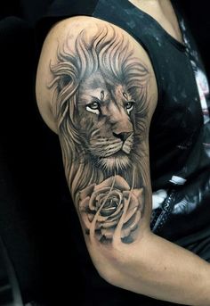 a woman with a lion and rose tattoo on her arm