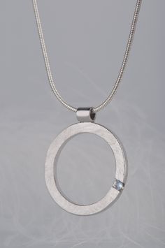 Are you looking for a gift idea for women? What would you say about this minimalist and delicate moonstone pendant necklace? Combination of this charming and delicate stone and rough, scratched silver surface makes the necklace look modern, but really subtle. Since moonstone is a June birthstone this necklace will be a great birthday gift for her. But it would also be a good choice if you are searching for an anniversary gift for your wife or girlfriend, or simply for yourself :) CHARACTERISTICS Modern Sterling Silver Jewelry With Round Stone, Modern Sterling Silver Round Stone Jewelry, Modern Sterling Silver Jewelry With Pearl Pendant, Modern Silver Birthstone Necklaces, Minimalist Sterling Silver Pearl Pendant, Minimalist Sterling Silver Pearl Pendant Jewelry, Minimalist Necklace With Bezel Setting And Round Pendant, Minimalist Sterling Silver Jewelry With Pearl Pendant, Modern Silver Birthstone Necklace