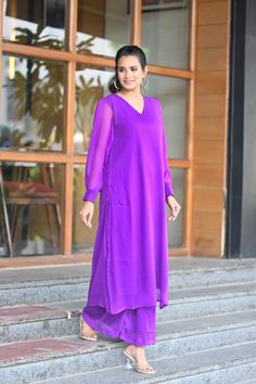 PRODUCT DESCRIPTION:-Let your personal style speak about your personality ,As you look absolutely gorgeous in our Purple Chiffone Co-Ord set.Kurta Fabric :- ChiffonPant Fabric :- ChiffonColor:-PurpleCare Instructions :- Dry clean onlyModel Size :- Model is wearing XS sizeModel Height :- 5.5''DISCLAIMER :- Slight color variations may occur due to different screen resolution. Elegant Purple Georgette Sets, Elegant Purple Long Sleeve Palazzo Set, Elegant Long Sleeve Purple Palazzo Set, Fitted Purple Palazzo Set With Long Sleeve, Chic Purple Party Sets, Festive Purple V-neck Sets, Chic Festive V-neck Sets, V-neck Party Sets In Georgette, Party Georgette V-neck Sets