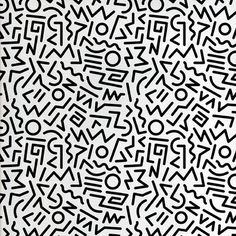 a black and white pattern with letters on the bottom, which are drawn in different directions