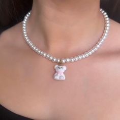 This dainty jewelry gift for her features a minimalist teddy bear charm on a white pearl necklace, perfect for women who adore teddy bears.🧸  𝐃𝐄𝐓𝐀𝐈𝐋𝐒:  ⭐️ Pearl Necklace length is 14 inches & includes a 2 inch extender  ⭐️ Teddy Bear Pendant size is 5/8 x 3/4 ⭐️ Includes glass pearls, gold stainless steel clasp & a fuzzy, soft white teddy bear charm  ⭐️ coquette styled pearl necklace, white fuzz on teddy bear charm will preserve white only with proper care ⭐️ ALL jewelry include 1 year w White Teddy Bear, Bear White, White Pearl Necklace, Pearl Jewelry Necklace, Bear Pendant, Necklace White, Polish Jewelry, Dainty Jewelry, Jewelry For Women