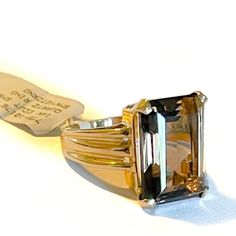 Lady’s 14k gold Smokey Quartz ring. The ring contains a center gemstone that is 18x12mm in diameter. The ring shoulders are 6.5mm and slightly taper. The weight of the ring is 6.8 grams. Size 6.5 and jeweler size-able. Formal Fine Jewelry Rings With Rectangular Stone, Classic Rings With Rectangular Stone For Formal Occasions, Classic Formal Signet Ring With Accent Stones, Classic Emerald Ring With Rectangular Stone For Formal Events, Classic Emerald Ring With Rectangular Stone For Formal Occasions, Classic Amethyst Ring With Rectangular Stone For Formal Occasions, Gold Signet Ring With Accent Stones For Formal Occasions, Formal Gold Signet Ring With Accent Stones, Formal 14k Gold Rings With Rectangular Stone