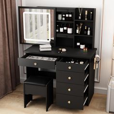 a black desk with drawers and a mirror