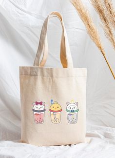 These cute boba canvas tote bags are reusable and can carry up to 30 pounds.  ITEM SIZE: 16in x 16in x 5in; 12 oz Price is for 1 sheet/decal/pack/charm/bag and pens are not included. ✿ DISCLAIMER Actual colors may be different on screen than the actual product. ✿ SHIPPING & TRACKING NUMBER If you would like a tracking number with your order, please message me! *Please understand that I will not be able to cover the cost for any lost mail for standard shipping! ✿ REFUNDS & CANCELLATIONS I will on Pink Bags With Cartoon Print For Daily Use, Rectangular Bags With Cartoon Print For Daily Use, Cute Beige Canvas Bag, Cute Rectangular Beige Canvas Bag, Cute Beige Cotton Shoulder Bag, Cute Rectangular Bag With Cartoon Print, Cute Rectangular Bags With Cartoon Print, Cute Multicolor Canvas Bag For School, Cute Beige Canvas Bag For Daily Use