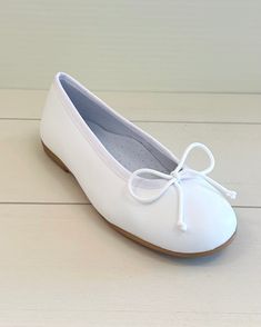 Beautiful and comfortable Spanish shoes for girls to wear on special occasions, such as the first communion. Please refer to the size conversion table. 100% leather Any variations in color or texture within this product are nor irregularities, but rather a result of the unique production process. Made in Spain Final Sale, no exchanges nor returns will be available Size EU28 = 18cm or 7 1/8" Size EU29 = 19cm or 7 1/2" SIze EU30 = 19.5cm or 7 3/4" Size EU31 = 20.5cm or 8 1/8" Size EU32 = 21cm or 8 White Round Toe Ballet Flats For Formal Occasions, White Leather Closed Toe Dance Shoes, White Round Toe Dance Shoes For Formal Occasions, White Leather Ballet Flats With Round Toe, White Closed Toe Spring Dance Shoes, White Closed Toe Ballet Flats With Rubber Sole, White Leather Sole Ballet Flats, White Leather Sole Ballet Flats With Closed Toe, White Closed Toe Ballet Flats With Leather Sole