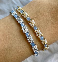 More details: - made out of white and golden or silver miyuki seed beads and blue crystal beads - threaded on nylon - closed with lobster clasps, jump rings 4mm, crimp ends and crimp covers made out of gold plated stainless steel  - available in six sizes: 15cm, 16cm, 17cm,  18cm, 20cm and 22cm How to take care: - the material is quite durable but as the stainless steel is gold plated, it is advisable to take off the bracelet when showering, for the colour to last longer Follow my Instagram @flo White Bracelet, White Bracelets, Floral White, Blue Crystals, Jump Rings, Diy Bracelets, Crystal Beads, Loom, Halloween Shopping